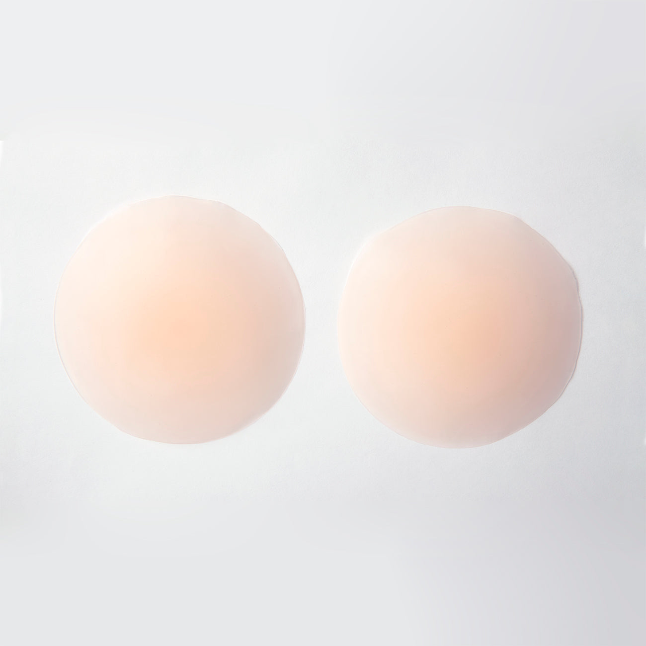 Product image of the adhesive concealers from the outside. They are thin and mildly opaque. The concealers are nude/beige in color.