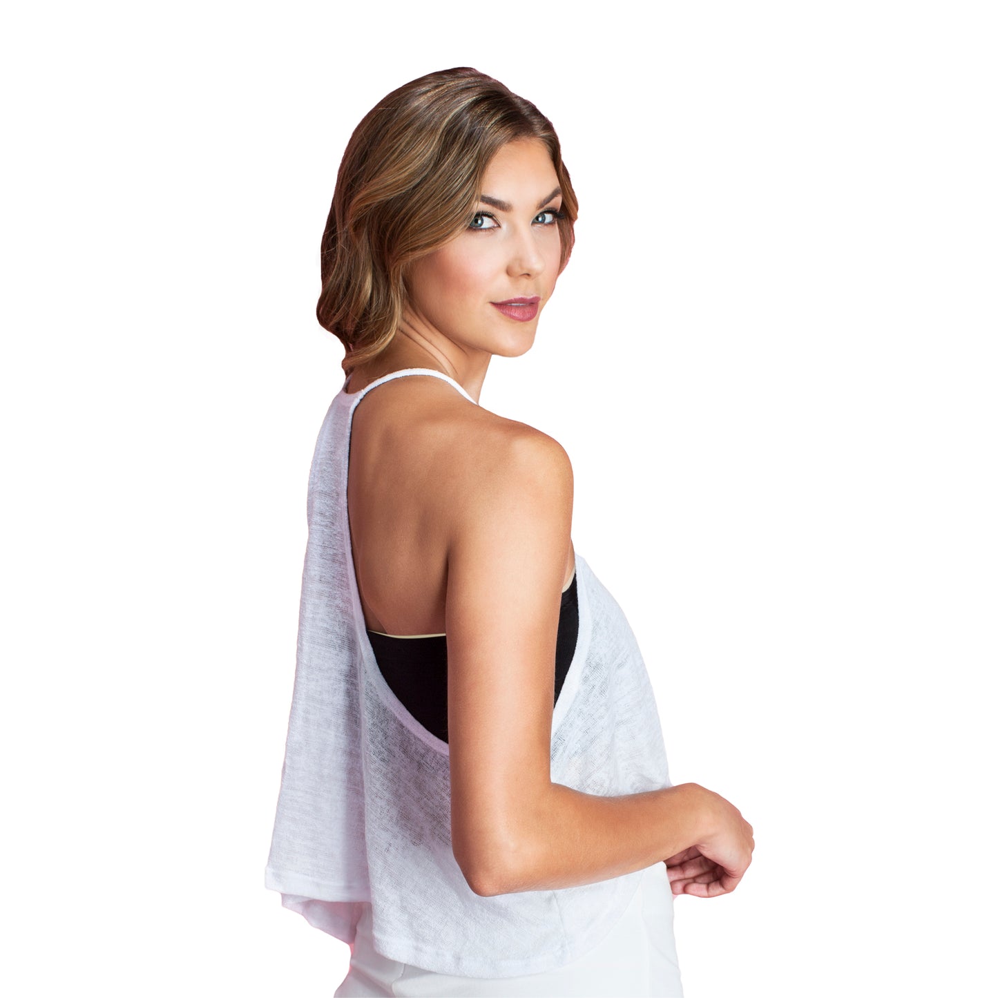 Model is wearing the black laser cut bandeau. It wraps around the body and is strapless. It provides coverage and is great for strapless tops. Model is wearing the bra underneath a white tank top.