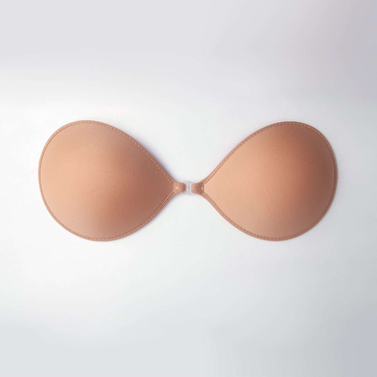 Outside of the nubra ultralite. It has a soft exterior and a clip in the front to hold the two cups together. Bra is nude in color.