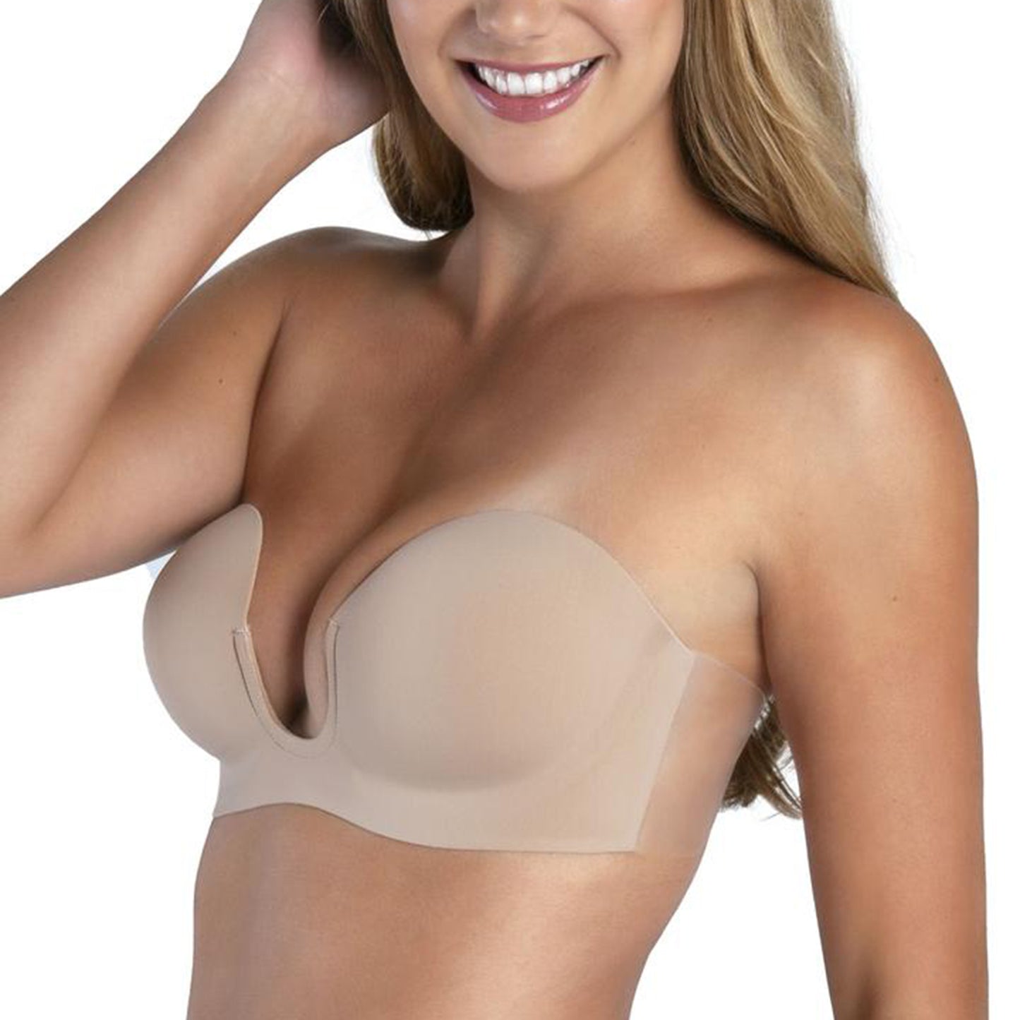 Model is wearing the Voluptuous U plunge Backless Strapless bra. The view is from a slight side angle. It shows the deep u shape in the center and the adhesive flaps on the sides of the bra.